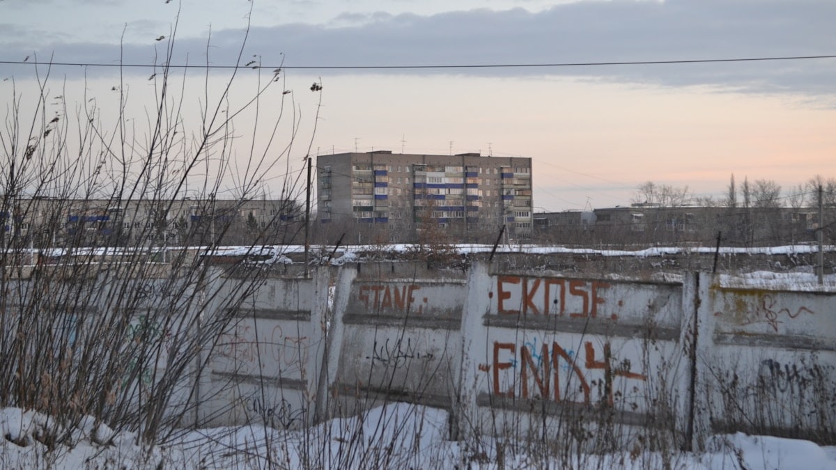 a building behind a fence